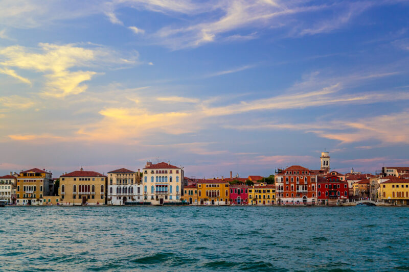 A view of the Venice skyline from across the water at sunset